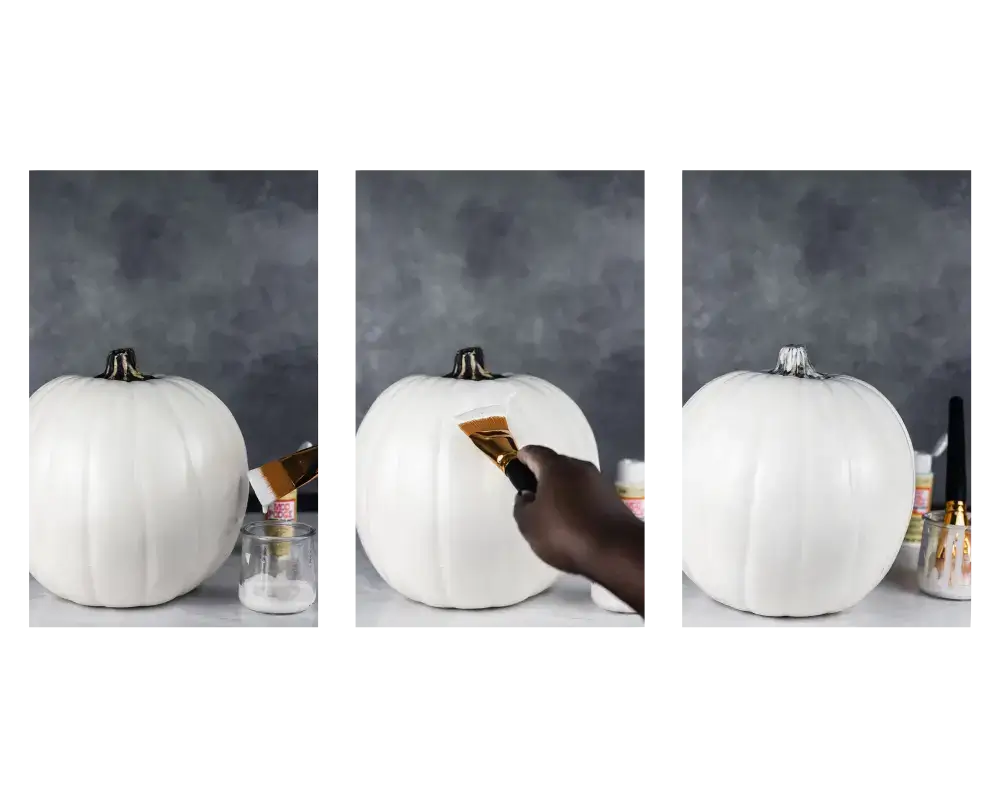 applying mod podge to the white pumpkin before painting