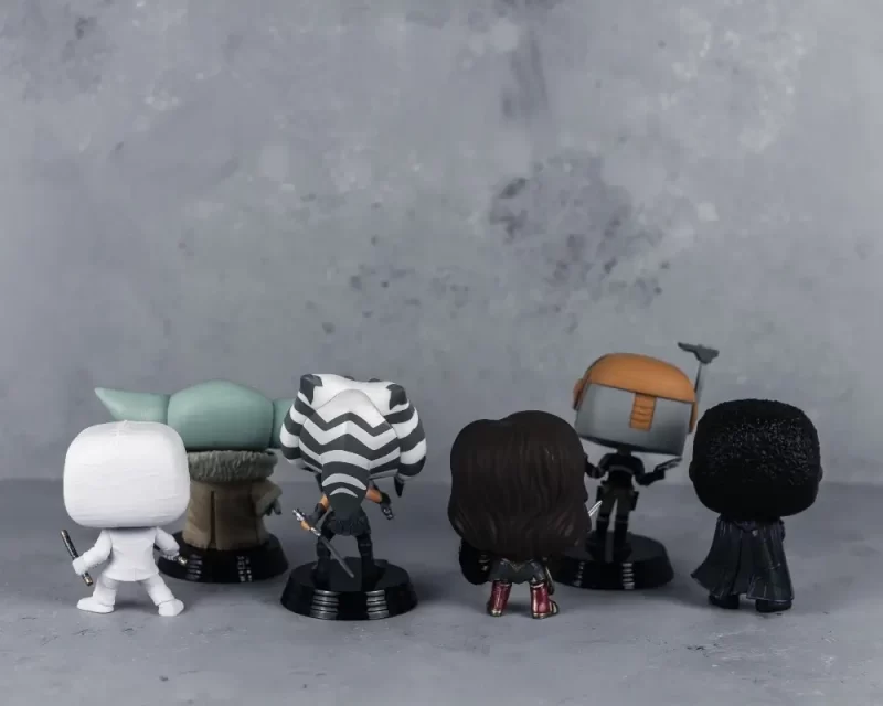 Funko POPS with their backs turned as content creators and the SAG-AFTRA strike