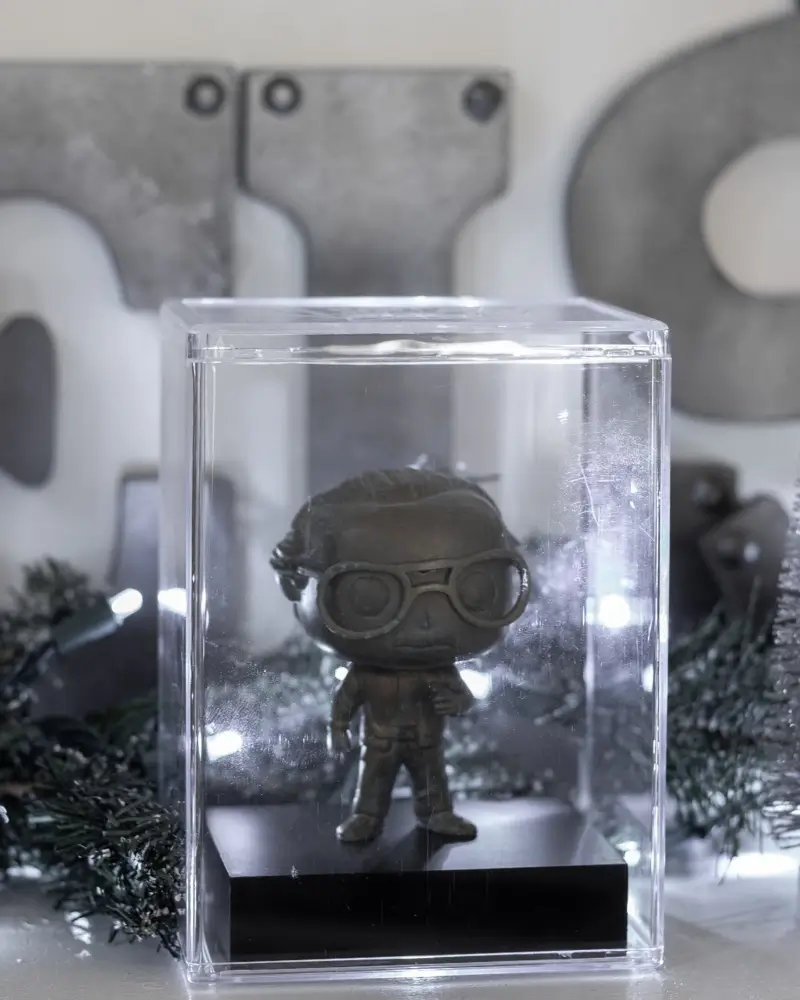 Stan Lee Funko POP, patina, on the fireplace